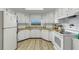 Bright kitchen with white cabinets, wood countertops, and modern appliances for a clean look at 5619 Bayshore Rd # 240, Palmetto, FL 34221