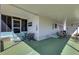 A look at the covered front porch featuring comfortable bench seating, a table, and inviting decor at 5619 Bayshore Rd # 240, Palmetto, FL 34221