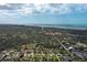 Sprawling aerial view of a residential area near the water, showcasing lush greenery at 587 Viridian St, Englewood, FL 34223