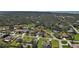 Aerial shot of a home in a residential area with lush landscaping, showcasing serene neighborhood at 587 Viridian St, Englewood, FL 34223