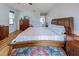 This bedroom features wood floors, natural light, and a view of the bathroom at 587 Viridian St, Englewood, FL 34223