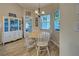 Cozy dining room featuring a charming table with a display cabinet and decorative stained glass windows at 587 Viridian St, Englewood, FL 34223