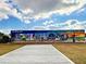 A colorful 'Greetings from Englewood' mural creating a vibrant landmark, with artistic details at 587 Viridian St, Englewood, FL 34223