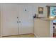 Welcoming entryway featuring double doors, neutral tones, and tile flooring at 587 Viridian St, Englewood, FL 34223