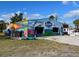 Colorful building with murals advertising Waterways, featuring tropical art and ocean themes at 587 Viridian St, Englewood, FL 34223