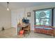 Cozy home office space with wood desk and chair next to window and ample storage at 587 Viridian St, Englewood, FL 34223