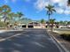 Elsie Quirk Public Library features a modern facade, ample parking, and lush tropical landscaping at 587 Viridian St, Englewood, FL 34223