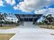 A modern outdoor stage with open design, set against a backdrop of trees and blue skies at 587 Viridian St, Englewood, FL 34223