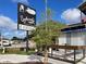 Englewood's on Dearborn restaurant sign promoting live blues music, framed by trees and outdoor seating at 587 Viridian St, Englewood, FL 34223