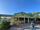 Restaurant exterior with outdoor seating and colorful decor in a vibrant setting at 587 Viridian St, Englewood, FL 34223