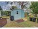Exterior of the storage shed with a small ramp, providing easy access for lawn equipment and tools at 587 Viridian St, Englewood, FL 34223