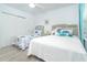 Charming bedroom featuring twin beds, soft colors, and bright natural light at 7518 Palm Island S Dr # 1213, Placida, FL 33946