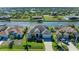 Beautiful aerial view of the home showcasing its lush landscaping, well-maintained exterior, and desirable waterfront location at 8144 Antwerp Cir, Port Charlotte, FL 33981