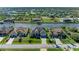 An aerial view showcasing the neighborhood, landscaping, and well-maintained residences along canal at 8144 Antwerp Cir, Port Charlotte, FL 33981