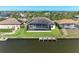 Waterfront home featuring a private pool, screened lanai, and a dock for easy access to the water at 8144 Antwerp Cir, Port Charlotte, FL 33981