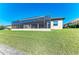 Well-maintained backyard with a screened lanai and views of the waterway, perfect for outdoor living and entertaining at 8144 Antwerp Cir, Port Charlotte, FL 33981