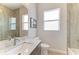 Bathroom featuring decorative tile, a large window, and a marbled granite countertop at 8144 Antwerp Cir, Port Charlotte, FL 33981