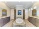 Luxurious bathroom with soaking tub, dual vanities, and elegant finishes at 8144 Antwerp Cir, Port Charlotte, FL 33981
