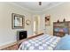 A cozy bedroom offers a traditional design, complete with beautiful, comfortable-looking quilt and stylish furnishings at 8144 Antwerp Cir, Port Charlotte, FL 33981