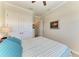 Bedroom featuring a large closet, a ceiling fan, and plenty of light at 8144 Antwerp Cir, Port Charlotte, FL 33981
