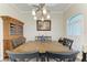 Lovely dining room setup with a large table, elegant chandelier, and ample seating at 8144 Antwerp Cir, Port Charlotte, FL 33981