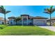 Charming one-story home with a manicured lawn, tile roof, and a well-maintained exterior at 8144 Antwerp Cir, Port Charlotte, FL 33981
