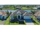 Beautiful exterior view of a one-story home featuring a tile roof, lush lawn, and waterfront access at 8144 Antwerp Cir, Port Charlotte, FL 33981