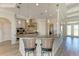 Modern kitchen with granite countertops, stainless steel appliances, and bar seating at 8144 Antwerp Cir, Port Charlotte, FL 33981