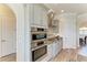 Modern kitchen showcasing stainless steel ovens and custom cabinetry at 8144 Antwerp Cir, Port Charlotte, FL 33981