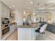 Stylish kitchen featuring granite countertops, stainless steel appliances, and bar seating at 8144 Antwerp Cir, Port Charlotte, FL 33981