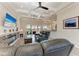 Spacious living room featuring a stone fireplace, coffered ceiling, and outdoor access at 8144 Antwerp Cir, Port Charlotte, FL 33981
