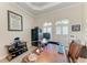 Spacious home office features a large desk, shutters, and a gun safe at 8144 Antwerp Cir, Port Charlotte, FL 33981