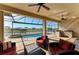 Covered patio with bar and canal view offers great entertaining space at 8144 Antwerp Cir, Port Charlotte, FL 33981
