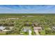 Aerial view of two houses on a canal with tropical scenery at 9350 Prospect Ave, Englewood, FL 34224