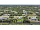 Aerial view of a neighborhood where homes sit on canals and lush green vegetation surrounds at 9350 Prospect Ave, Englewood, FL 34224