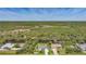 Aerial view of two houses on a waterway with green land across the way at 9350 Prospect Ave, Englewood, FL 34224