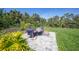 Inviting backyard patio with comfortable seating, perfect for outdoor lounging and entertaining guests at 9350 Prospect Ave, Englewood, FL 34224