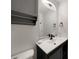 Bathroom featuring a gray vanity with modern countertop and fixtures at 9350 Prospect Ave, Englewood, FL 34224