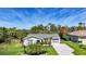 Inviting home exterior with manicured lawn, palm trees, and neutral tones blending with the landscape at 9350 Prospect Ave, Englewood, FL 34224