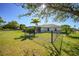 Fenced backyard with well-maintained lawn and tasteful landscaping, creating a private outdoor space at 98 Seasons Dr, Punta Gorda, FL 33983