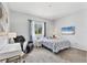 Comfortable bedroom featuring carpet, a window with curtains, and a television at 10082 Army Cir, Port Charlotte, FL 33981