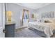 Comfortable bedroom featuring carpet, a window with curtains, and a queen-size bed at 10082 Army Cir, Port Charlotte, FL 33981