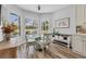 Inviting breakfast nook features a round table, cushioned chairs, and large windows with exterior views at 10082 Army Cir, Port Charlotte, FL 33981