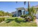 Charming home with a well-maintained front yard and an American flag at 10082 Army Cir, Port Charlotte, FL 33981