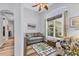 Comfortable living room featuring neutral colors, a large window, and a cozy seating arrangement at 10082 Army Cir, Port Charlotte, FL 33981