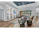 Open-concept living room with built-in shelves and access to the pool area at 10082 Army Cir, Port Charlotte, FL 33981