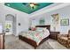 Spacious primary bedroom boasts a decorative ceiling, wood furniture, and ample natural light from large windows at 10082 Army Cir, Port Charlotte, FL 33981