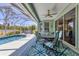 Relax poolside in this screened-in lanai with comfortable seating and a dining area at 10082 Army Cir, Port Charlotte, FL 33981
