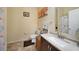 Bathroom featuring a granite vanity and shower with decorative curtain at 10183 Winding River Rd, Punta Gorda, FL 33950