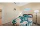 Bedroom featuring a bright window, wood-look flooring and nautical themed decor at 10183 Winding River Rd, Punta Gorda, FL 33950
